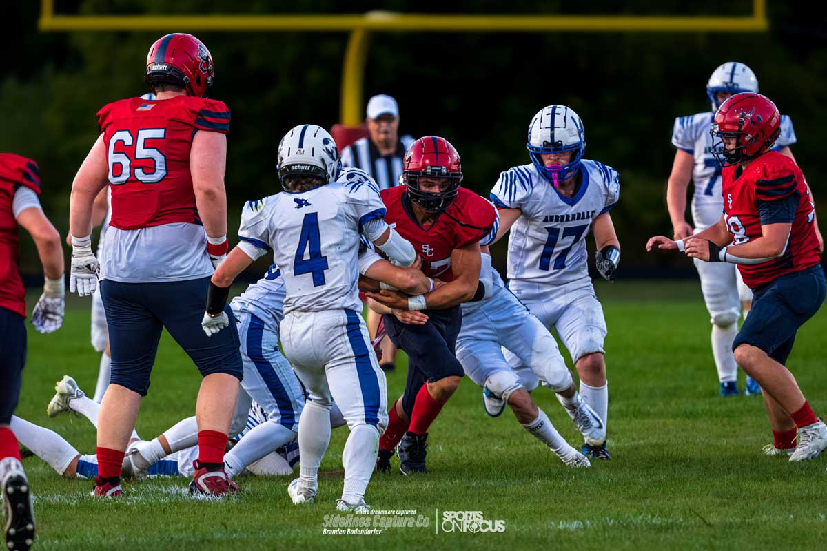 Auburndale defenders wrapping up a Spencer/Columbus running back at the line of scrimmage during Friday night football
